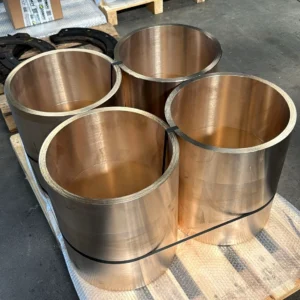 Set of four large bronze bushings on pallet, just shipped in.